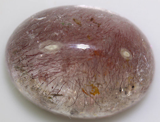 A pink stone with a lot of dust on it.