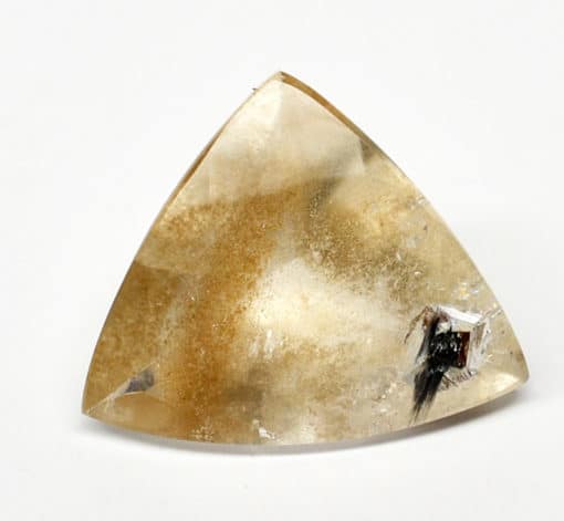 A triangular shaped piece of yellow quartz.