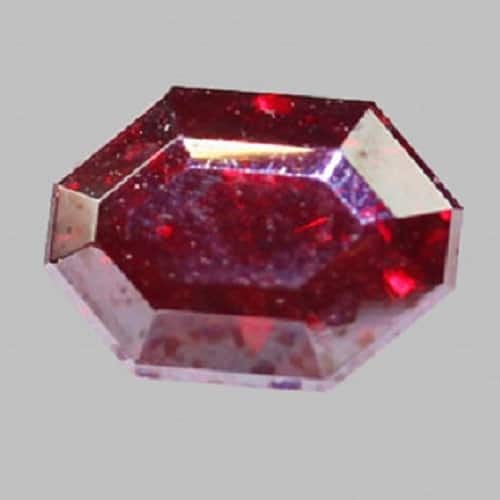 An octagonal red sapphire on a gray background. Purchase Gems to get a Discount 25%.