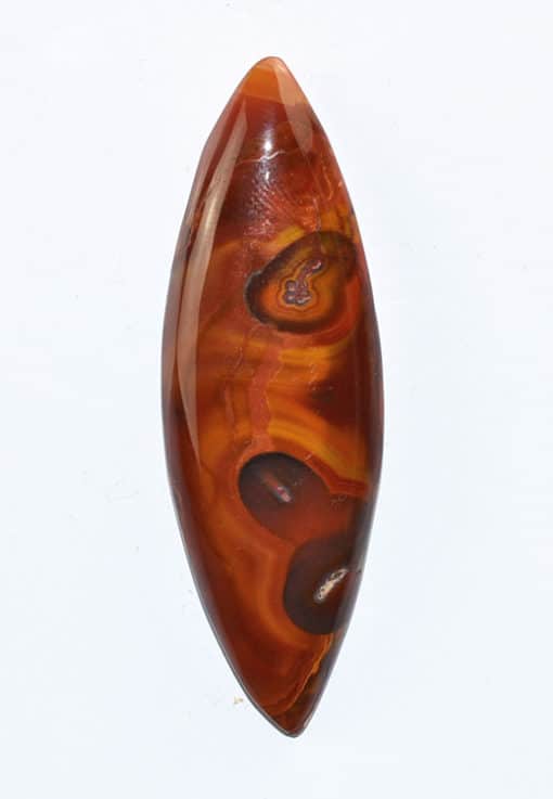 A brown and orange agate pendant on a white background.
