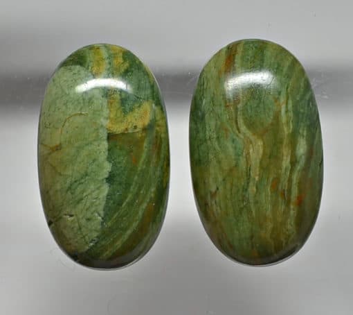 A pair of green jasper cabochons.