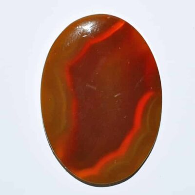 An oval agate stone on a white background.