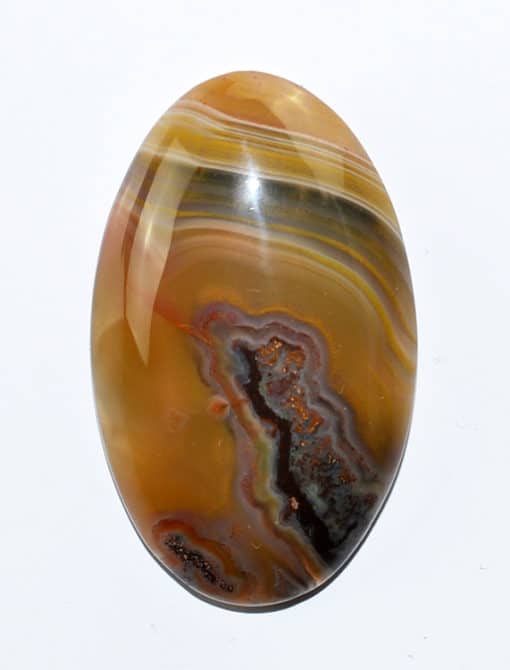 An oval agate stone on a white background.