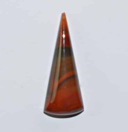 A cone shaped piece of orange agate.