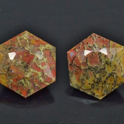 A pair of red and yellow octagonal shaped cabochons.