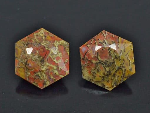 A pair of red and yellow octagonal shaped cabochons.