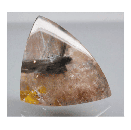 A triangular piece of Anatase and Rutile in Quartz 53.85cts Superb Trillion Cabochon 33.00 x 25.00mm Brazil H7 Y11474 with a yellow flower on it.