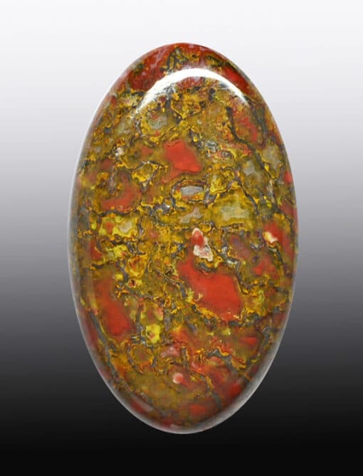 A red, yellow and green stone cabochon.