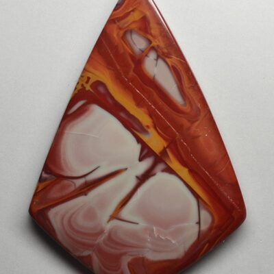 A pendant made of red and white marble.