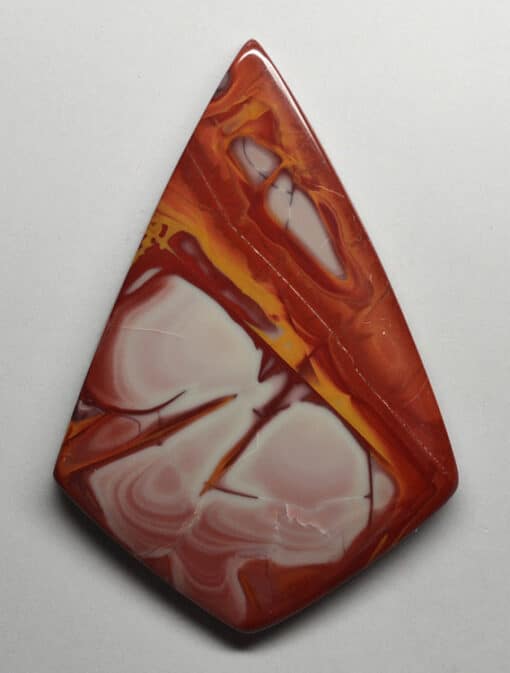 A pendant made of red and white marble.