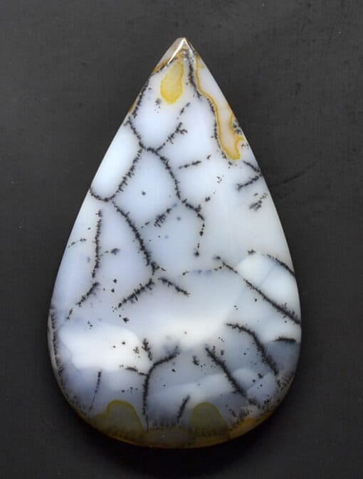 A white and yellow agate tear shaped pendant.