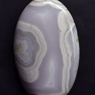 A purple agate stone on a black background.