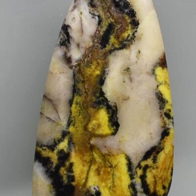 A piece of yellow and black jasper.