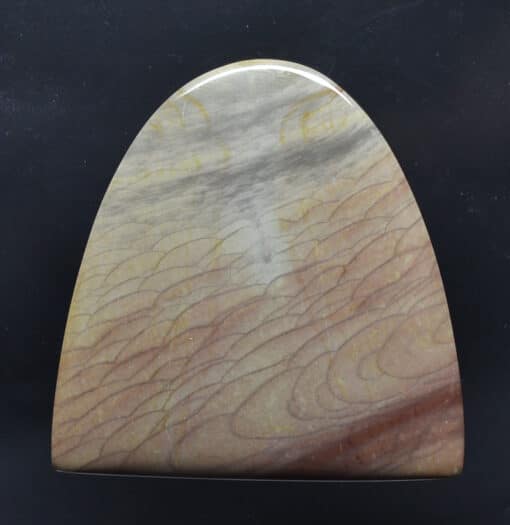 A piece of stone with a brown and yellow pattern.