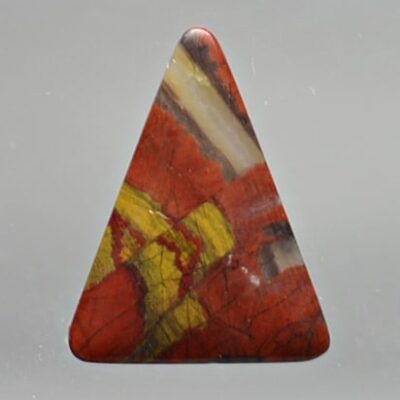 A red and yellow triangular shaped stone.