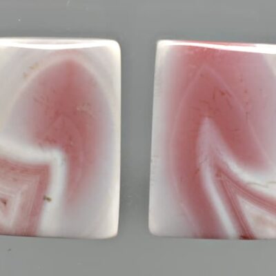 A pair of pink and white agate earrings.