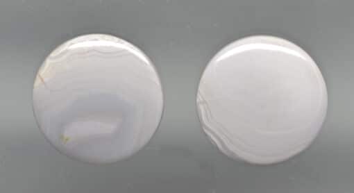 A close-up of two white buttons.