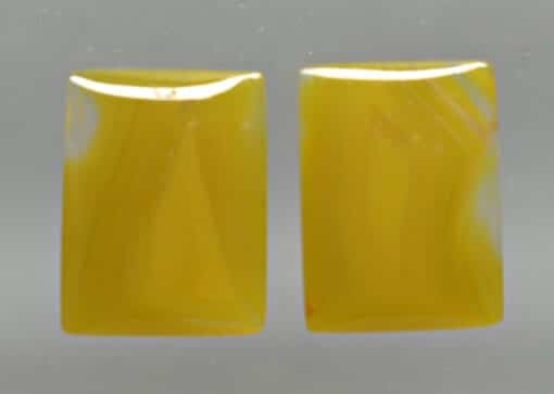 A pair of yellow agate stud earrings.