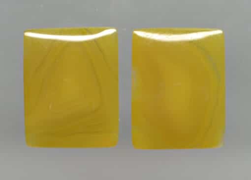 A pair of yellow agate cabochons.
