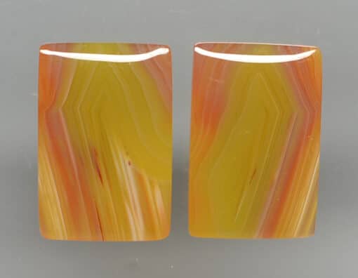 A pair of yellow and orange agate earrings.