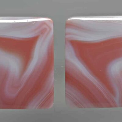 A pair of pink and white marbled squares.