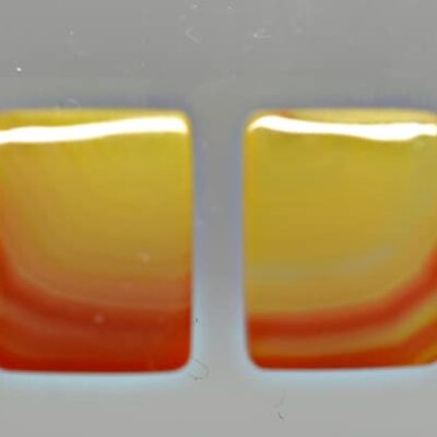 A pair of yellow and orange square shaped objects.