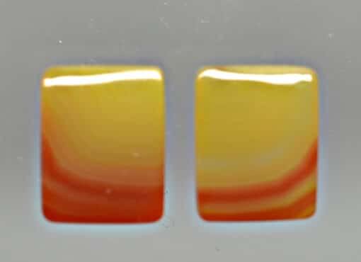 A pair of yellow and orange square shaped objects.