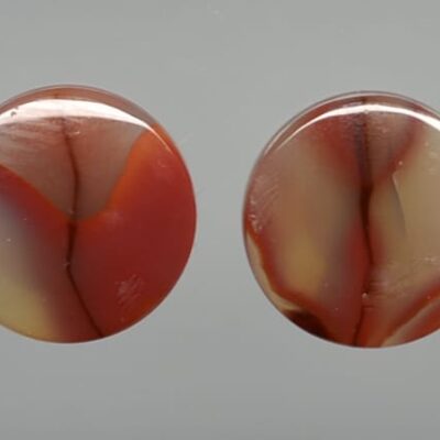 Two oval agate cabochons.