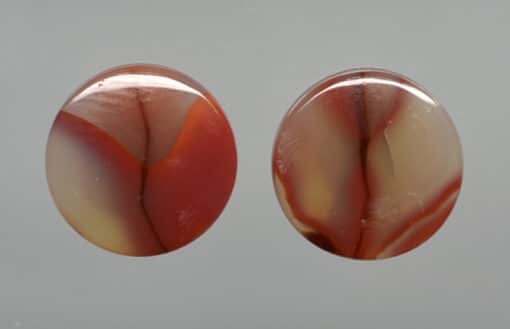 Two oval agate cabochons.