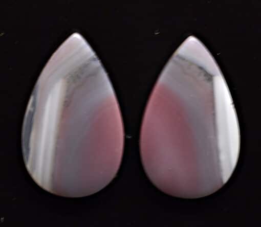 Two pink and white agate tear shaped cabochons.
