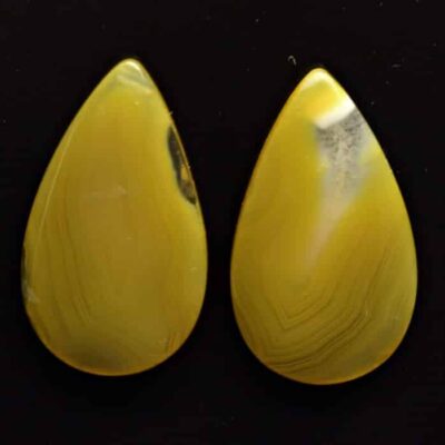 Two yellow agate tear shaped cabochons.