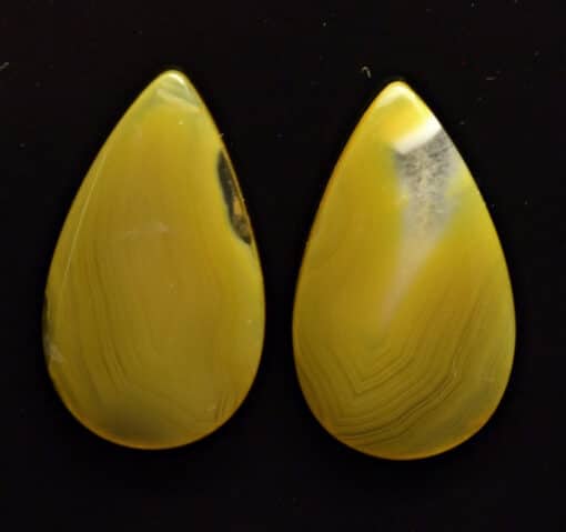 Two yellow agate tear shaped cabochons.