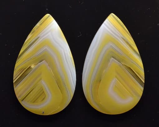 Two yellow and white agate tear shaped cabochons.