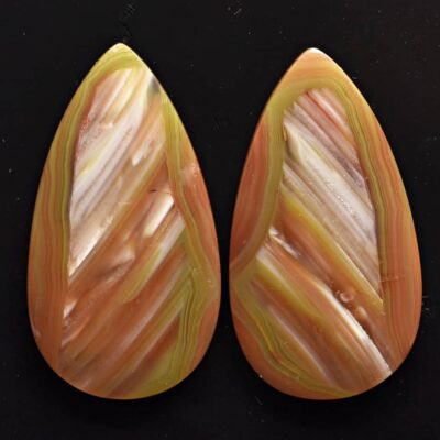 A pair of orange and yellow tear shaped cabochons.