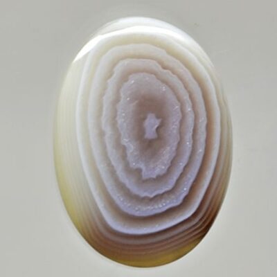 An agate stone with a white and brown pattern.