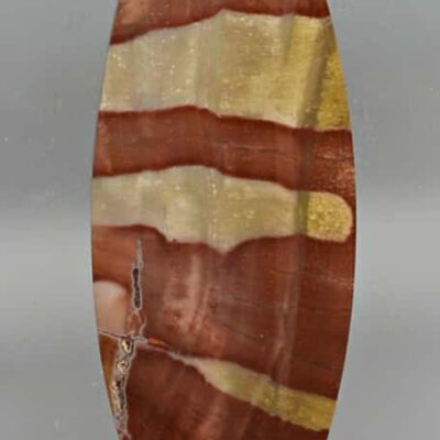 A piece of brown and gold striped agate.