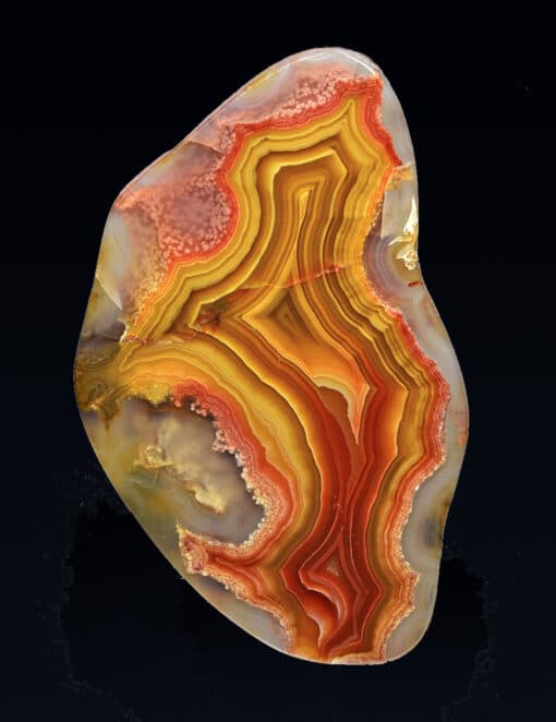 A piece of agate on a black background.