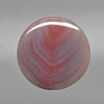 A round pink and white stone.