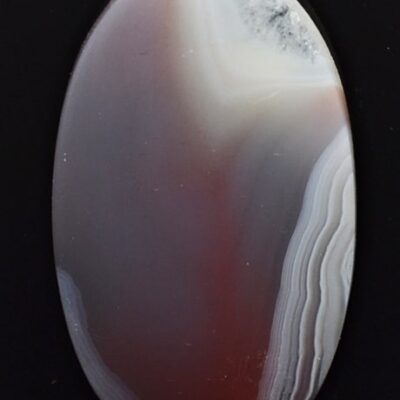An agate stone with a red and purple color.