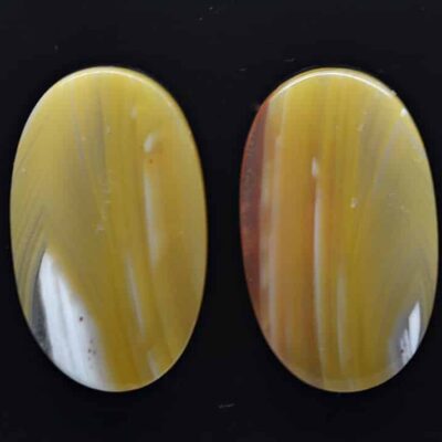 A pair of yellow agate oval cabochons.