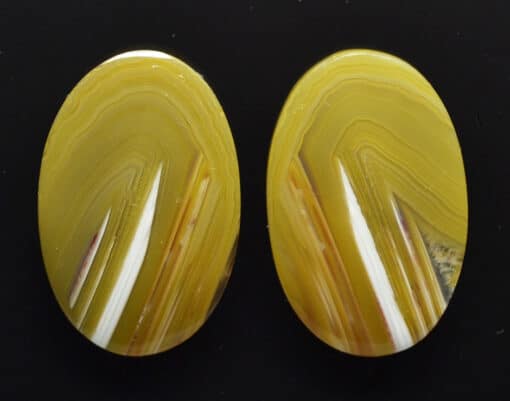Pair of yellow agate oval cabochons.