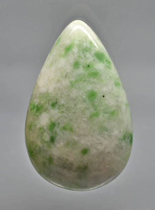 A green jade tear shaped stone.