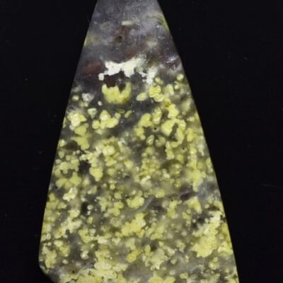 A triangle shaped piece of yellow jasper.