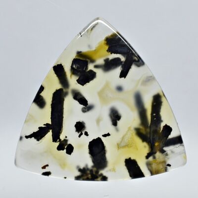 A triangular piece of yellow and black agate.