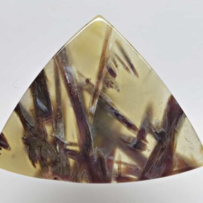 A triangular piece of amethyst.