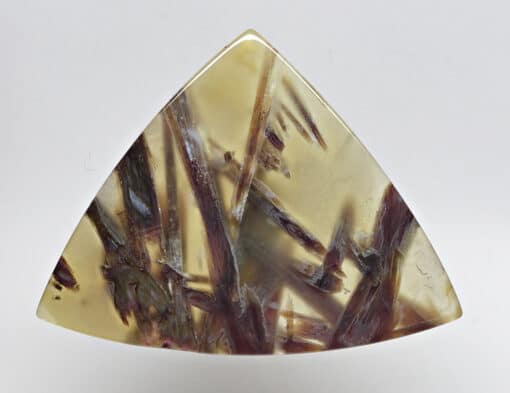 A triangular piece of amethyst.