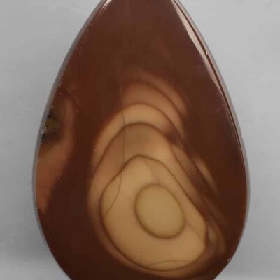 A brown tear shaped piece of agate.