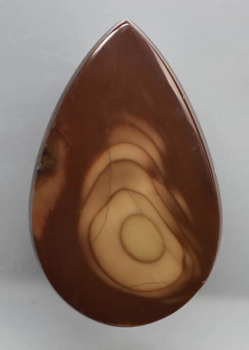 A brown tear shaped piece of agate.