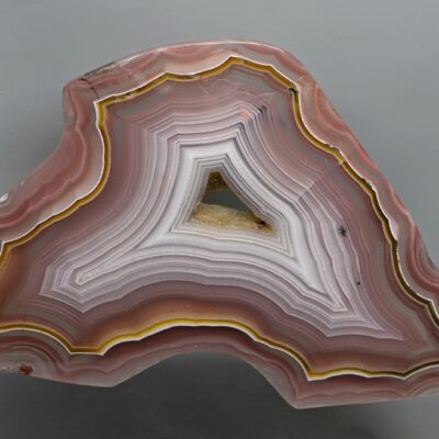 A piece of pink agate on a white background.
