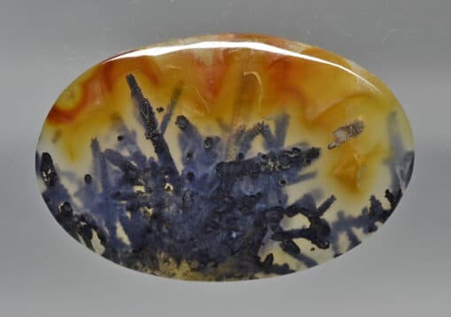 A blue and orange agate pendant.